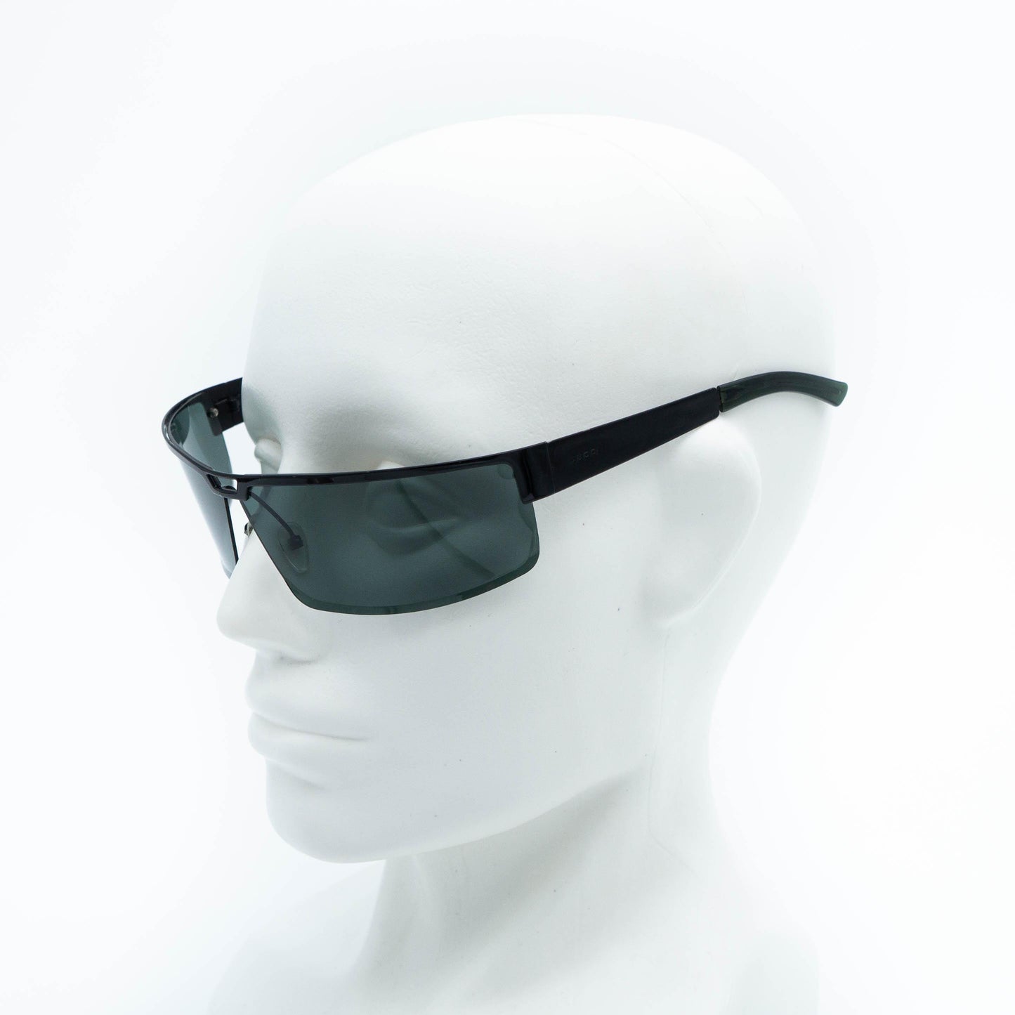 Gucci black shield sunglasses on mannequin profile