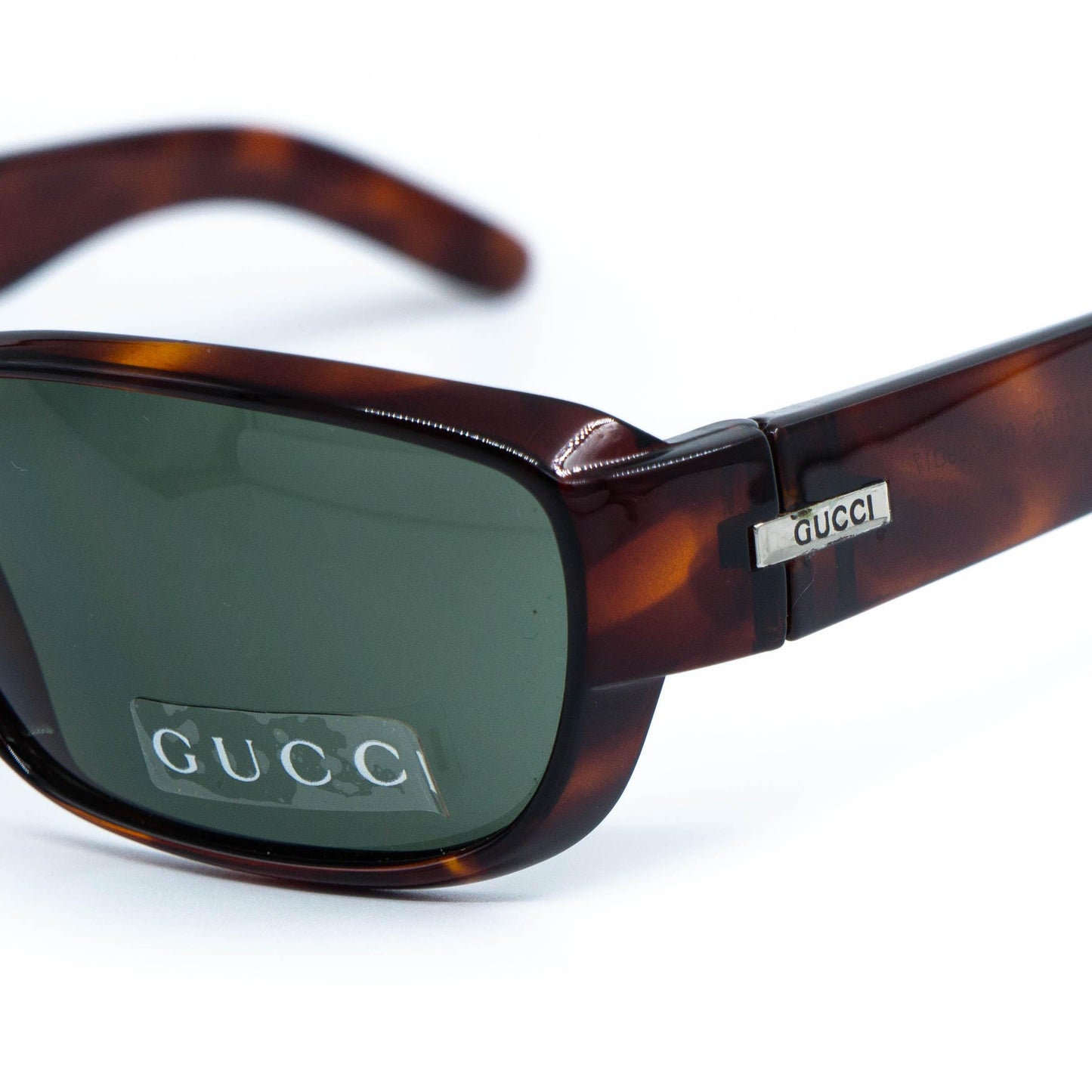 Close-up of Gucci logo on temple