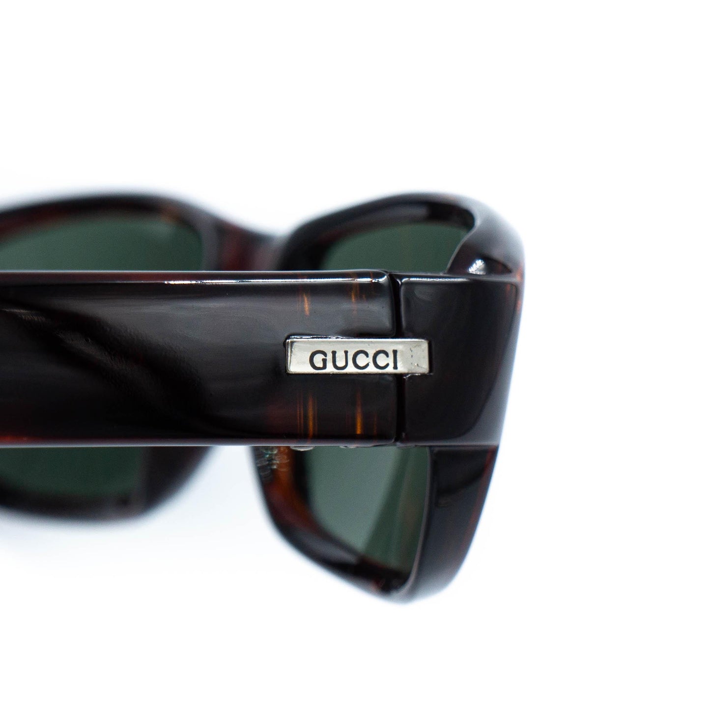 Close-up of Gucci logo on temple