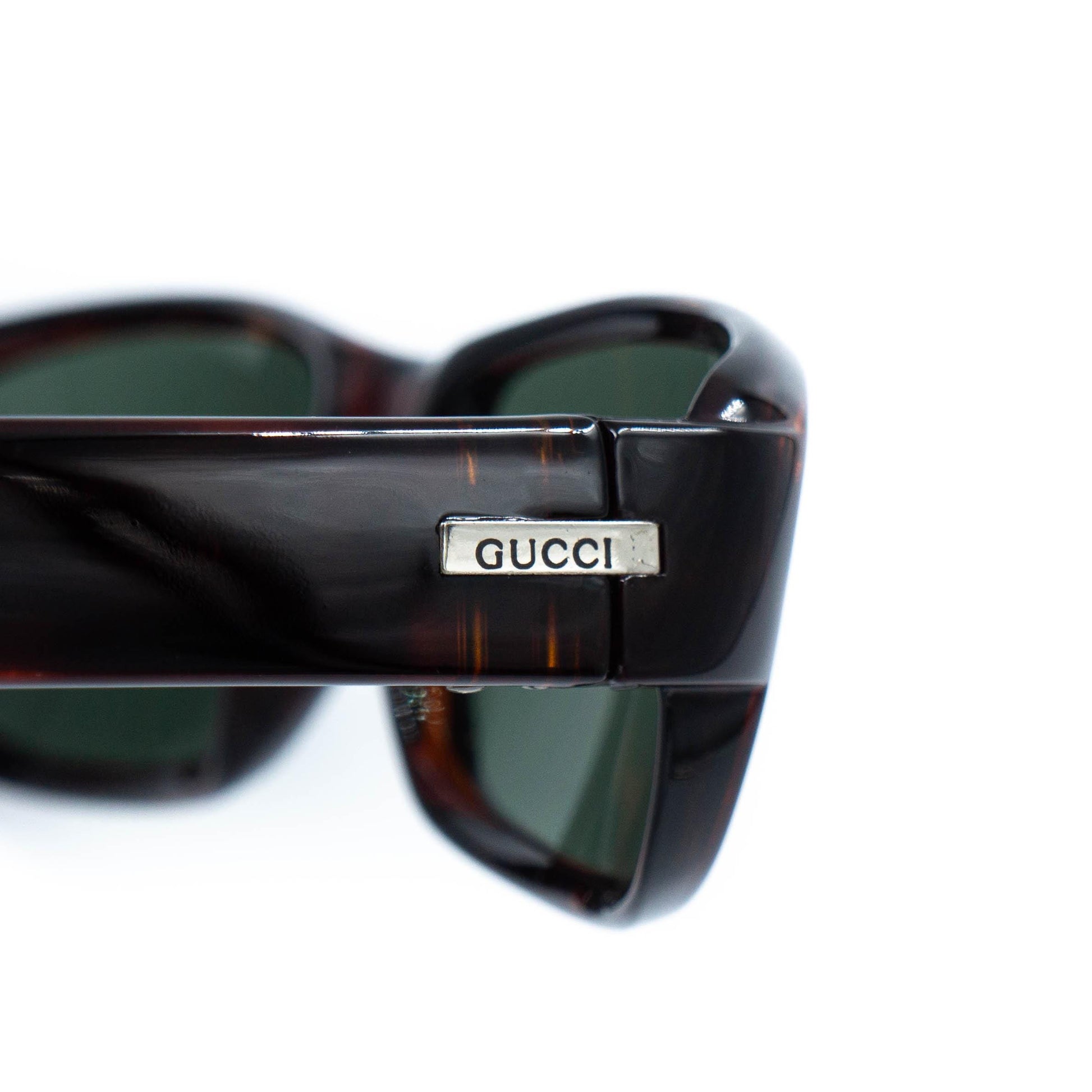 Close-up of Gucci logo on temple