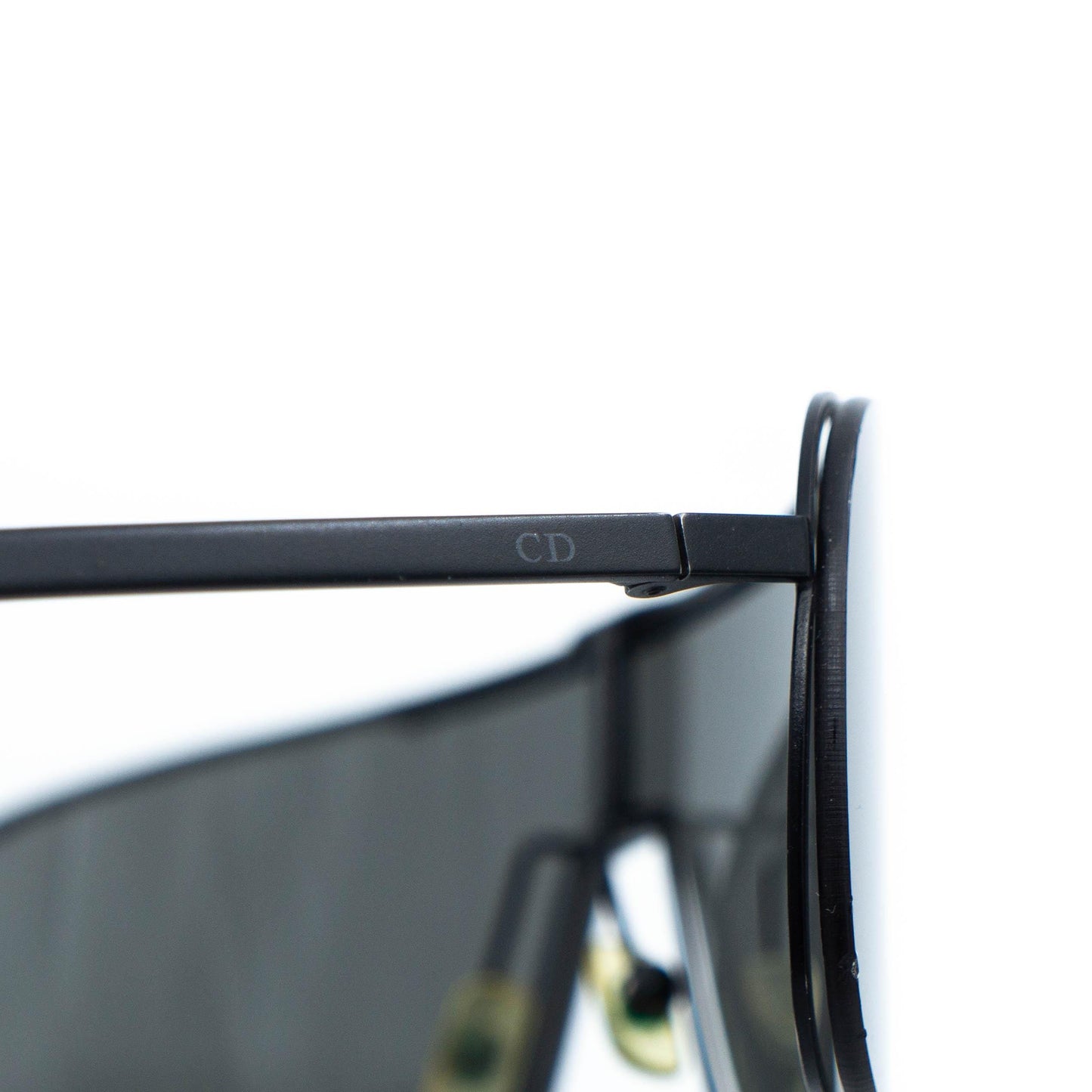 Dior logo detail close-up on temple hinge