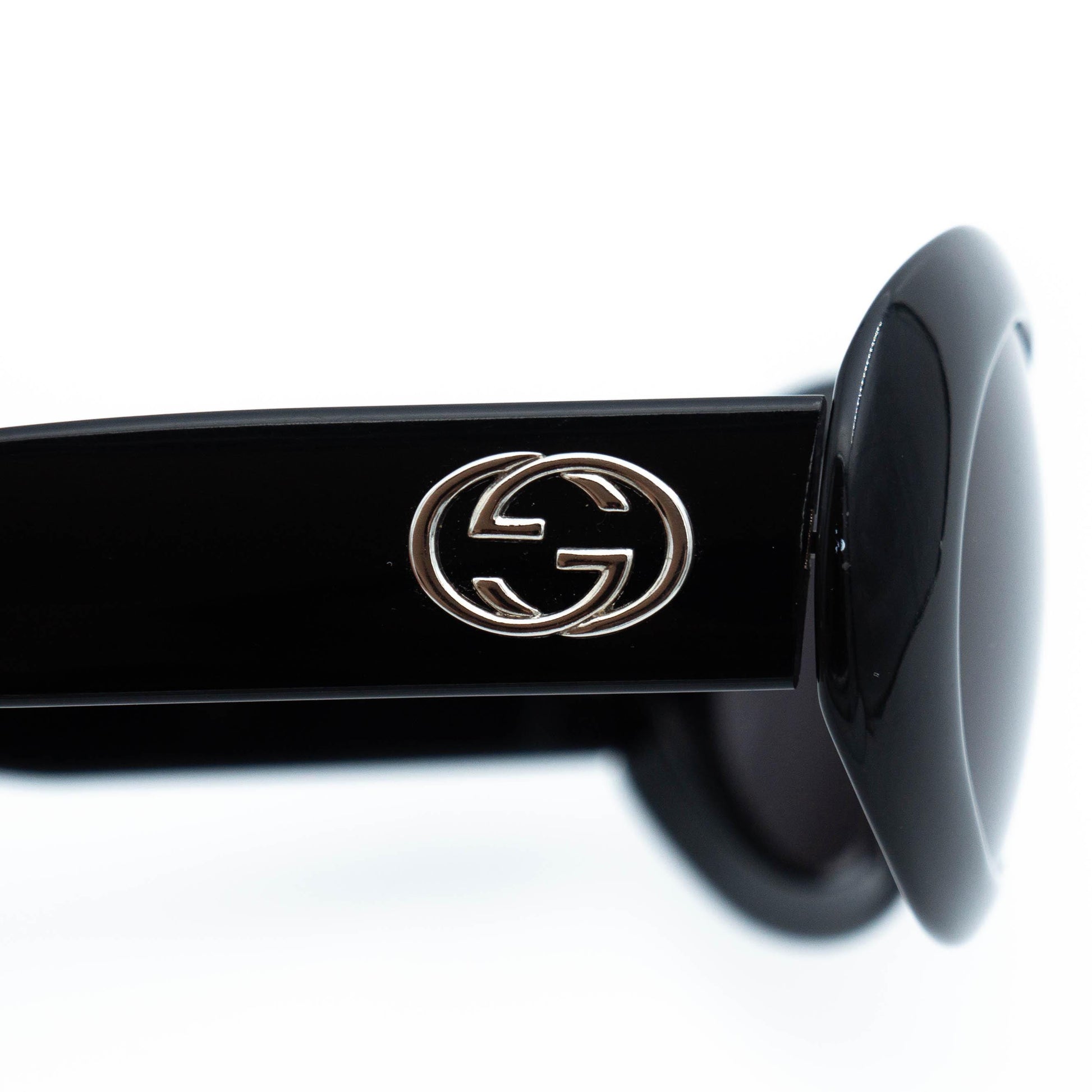 Close-up of Gucci GG logo on temple